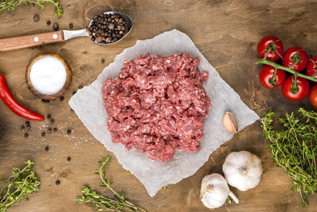 Healthy Ground Chicken Recipes: A vibrant presentation of healthy ground chicken recipes, including chicken lettuce wraps, tacos, meatballs with zoodles, and stuffed bell peppers, styled with fresh vegetables and garnishes