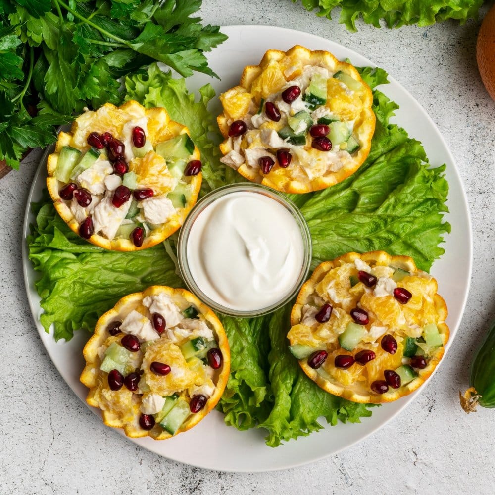 Top Healthy Cottage Cheese Lunch Ideas for You" 3 Healthy Cottage Cheese Lunch Ideas: "Vibrant plate featuring healthy cottage cheese cups with diced cucumber, orange segments, pomegranate seeds, and a creamy yogurt dip."