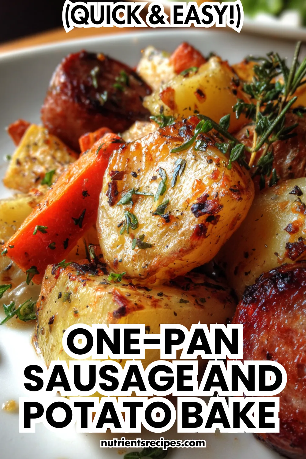 Easy one-pot roasted potato and sausage bake with bell peppers and onions on sheet pan garnished with fresh parsley